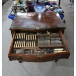 A mahogany inlaid bowfront two drawer canteen of stainless steel cutlery, with glass preserve, 130