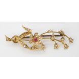 A 15ct gold pearl and red gem flower brooch stamped Dunklings, with Australian hallmarks, length