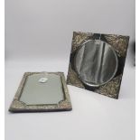 An Art Nouveau silver mounted square mirror, leather backed with a circular glass panel, with