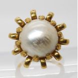 A bright yellow mabe pearl ring, stamped both 750 and 18k, size L1/2, weight 10.9gms Condition