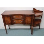 A 20th century mahogany sideboard with two central drawers flanked by cabinet doors on square