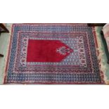 A red ground eastern rug with multiple borders, 187cm long x 122cm wide Condition Report:Available