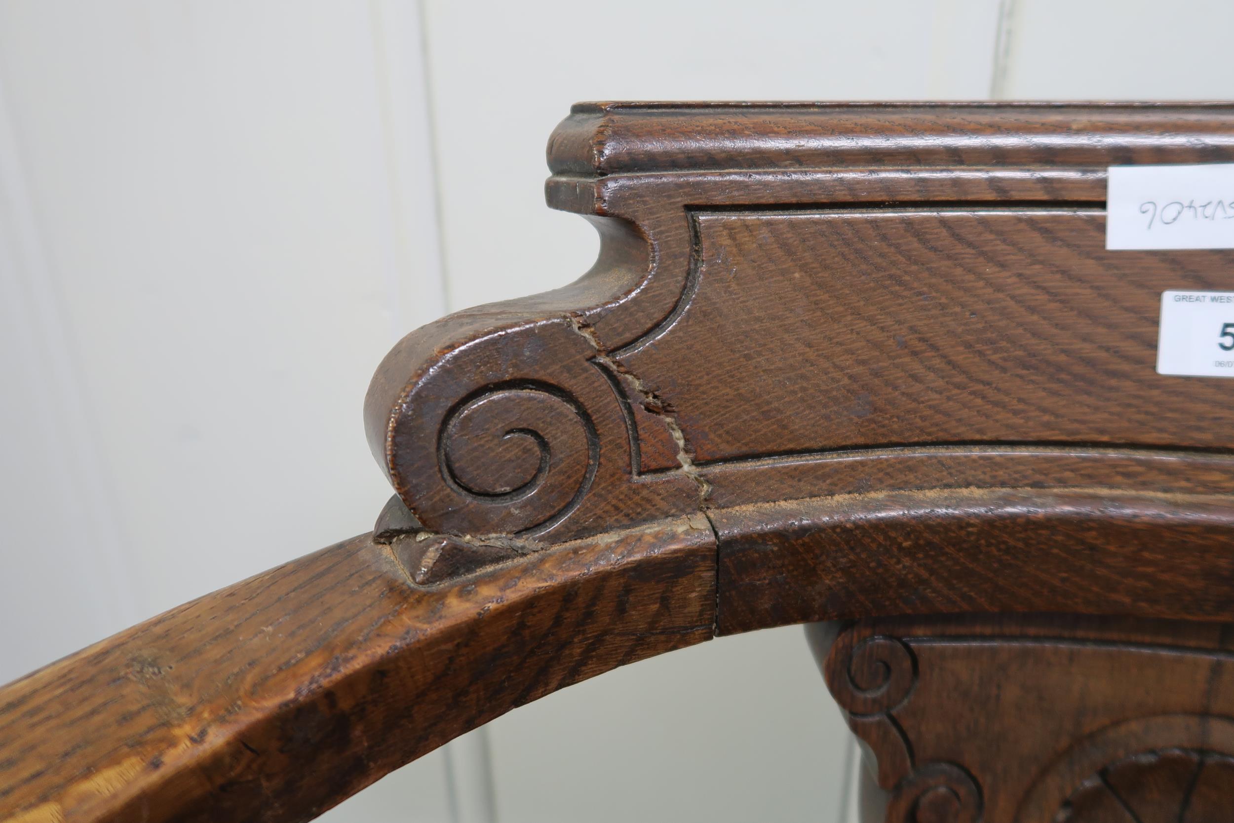 A pair of oak framed revolving ships captain chairs with red rexine seats (2) Condition Report: - Image 2 of 2