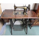 An early 20th century Singer cast iron base treadle sewing machine Condition Report:Available upon