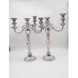 A pair of silver plated three light candelabra, in the Georgian style, 42cm (2) Condition Report: