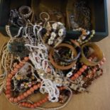 A jewellery box full of vintage costume jeweller to include, a horn bangle, a bone Stanhope with