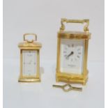 A David Petersen brass and glass cased carriage clock, with key, and a small brass and glass cased