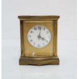 A French brass & glass bowfront carriage clock, 9cm high Condition Report:winds and ticks, glass
