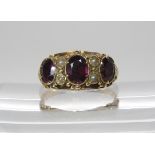 A Victorian style garnet and pearl ring, size approx P1/2, weight 3.3gms (af, shank split) Condition