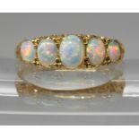 AN 18CT GOLD FIVE STONE OPAL RING the opals are very lively with the full spectrum of colours,