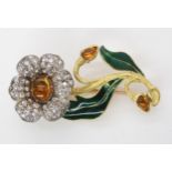 AN ART NOUVEAU FLOWER BROOCH this craftman made brooch is set with citrines, with enamelled