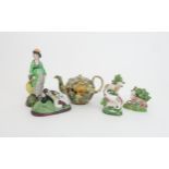 A WHIELDON-TYPE TEAPOT with applied floral decoration and slip glaze, a Pearlware figure of a lady
