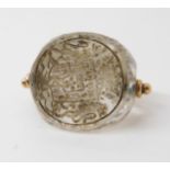 AN INTAGLIO CARVED SWIVEL SEAL the three sided rock crystal carved with a motto in French, 'Ce Qui
