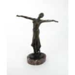 AN ART DECO STYLE DANCER upon marble base, 39cm high Condition Report:Available upon request