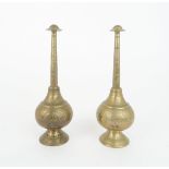 A PAIR OF INDIAN BRASS ROSE WATER SPRINKLERS each decorated with peacocks and foliage, 20.5cm high