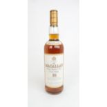 A BOTTLE OF THE MACALLAN 10 YEAR OLD SINGLE MALT WHISKY matured in selected sherry oak cask from