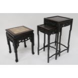 A 19TH CENTURY CHINESE HARDWOOD NEST OF TWO TABLES with carved fretwork friezes depicting dragons,