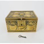 AN ARTS AND CRAFTS BRASS TRINKET BOX decorated with scrolling foliage and mistletoe, with italic A