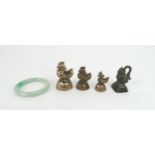 A CHINESE HARDSTONE BANGLE 7.7cm diameter and four Burmese bronze opium weights, cast as ducks and a