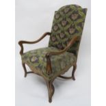 A 19TH CENTURY CONTINENTAL STYLE MAHOGANY FRAMED OPEN ARMCHAIR back and seat upholstered in a