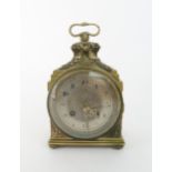 A FRENCH BRASS MANTLE CLOCK  with silvered dial, chiming on the quarter, with laurel wreath