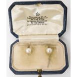 A PAIR OF GARRARD'S PEARL CUFFLINKS mounted in yellow metal the pearls measure approx 5.6mm. In