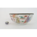 A CHINESE EXPORT PUNCH BOWL painted with panels of gentlemen holding opium pipes and ladies in