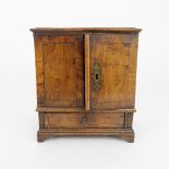 AN APPRENTICE PIECE CHEST the two door opening to reveal shelves above a drawer, 26cm high Condition
