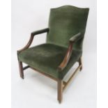 A GEORGIAN MAHOGANY FRAMED OPEN ARMCHAIR with green upholstery on stretchered square chamfered