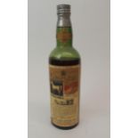 A BOTTLE OF WHITE HORSE WHISKY bottled 1938, No. 5647029, below shoulder Condition Report: