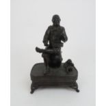 A JAPANESE BRONZE MUSICIAN the seated man with drum and two monkeys on a patterned base resting on