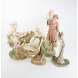 A ROYAL DUX ART NOUVEAU CENTREPIECE depicting maidens seated upon a conch shell, stamped 1066, 37cms