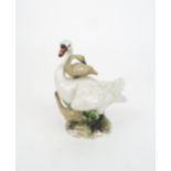 A MEISSEN STYLE GROUP OF A SWAN AND CYGNETS incised mark to base Condition Report:Available upon