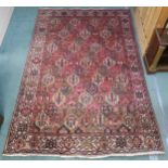 A MULTICOLOURED GROUND BAKHTIARI RUG with all over geometric lozenge design and a cream