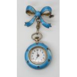 AN ENAMELLED BROOCH PENDANT WATCH enamelled in turquoise guilloche enamel, the bezeland the back are