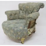 A 19TH CENTURY BUTTON BACK TUB ARMCHAIR upholstered in Howard & Sons monogram-print fabric on