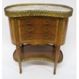 A CONTINENTAL KINGWOOD AND BRASS MOUNTED KIDNEY SHAPED CHEST OF THREE DRAWERS with galleried