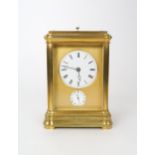 A FRENCH BRASS CARRIAGE REPEATER/ALARM CLOCK with gilt metal and white enamel dial with Roman