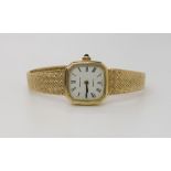 A 9CT GOLD LADIES ZENITH QUARTZ WATCH the octagonal dial with black Roman numerals, with integral