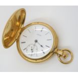 AN 18CT GOLD WALTHAM FULL HUNTER  with white enamelled dial with black Roman numerals and subsidiary