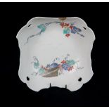 A KAKIEMON PIERCED BOWL painted with a squirrel amongst grape vines on a moulded foliate ground,