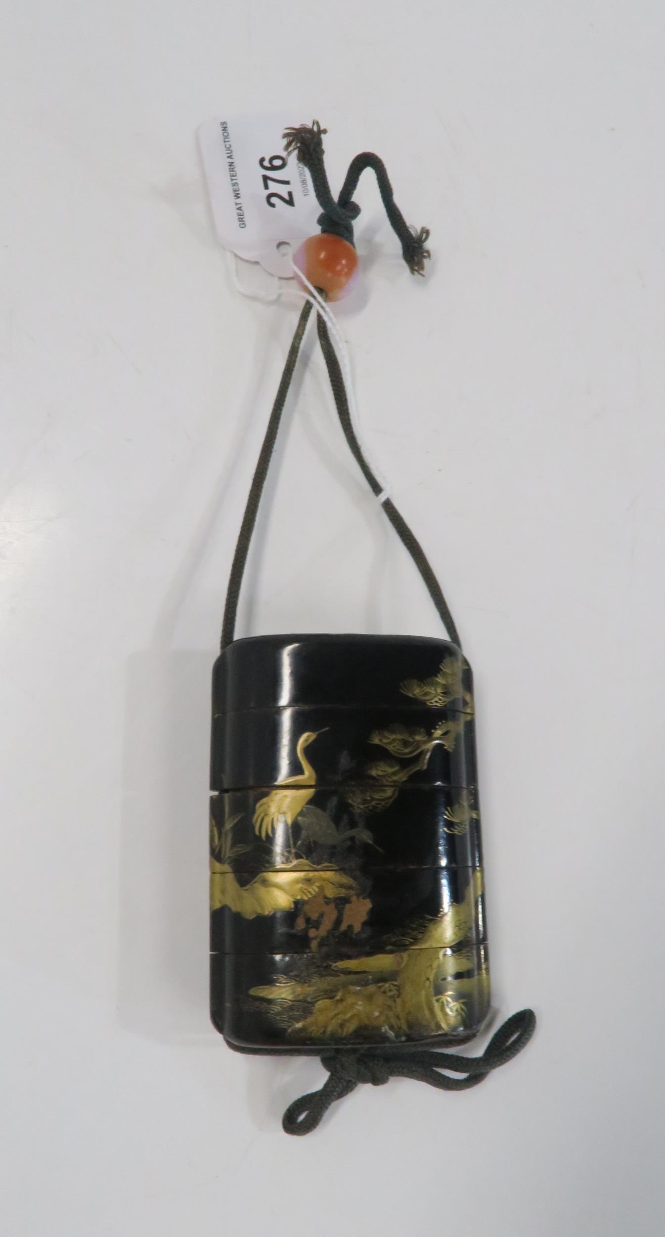 A Japanese five case lacquered inro decorated with cranes and trees Condition Report:Available