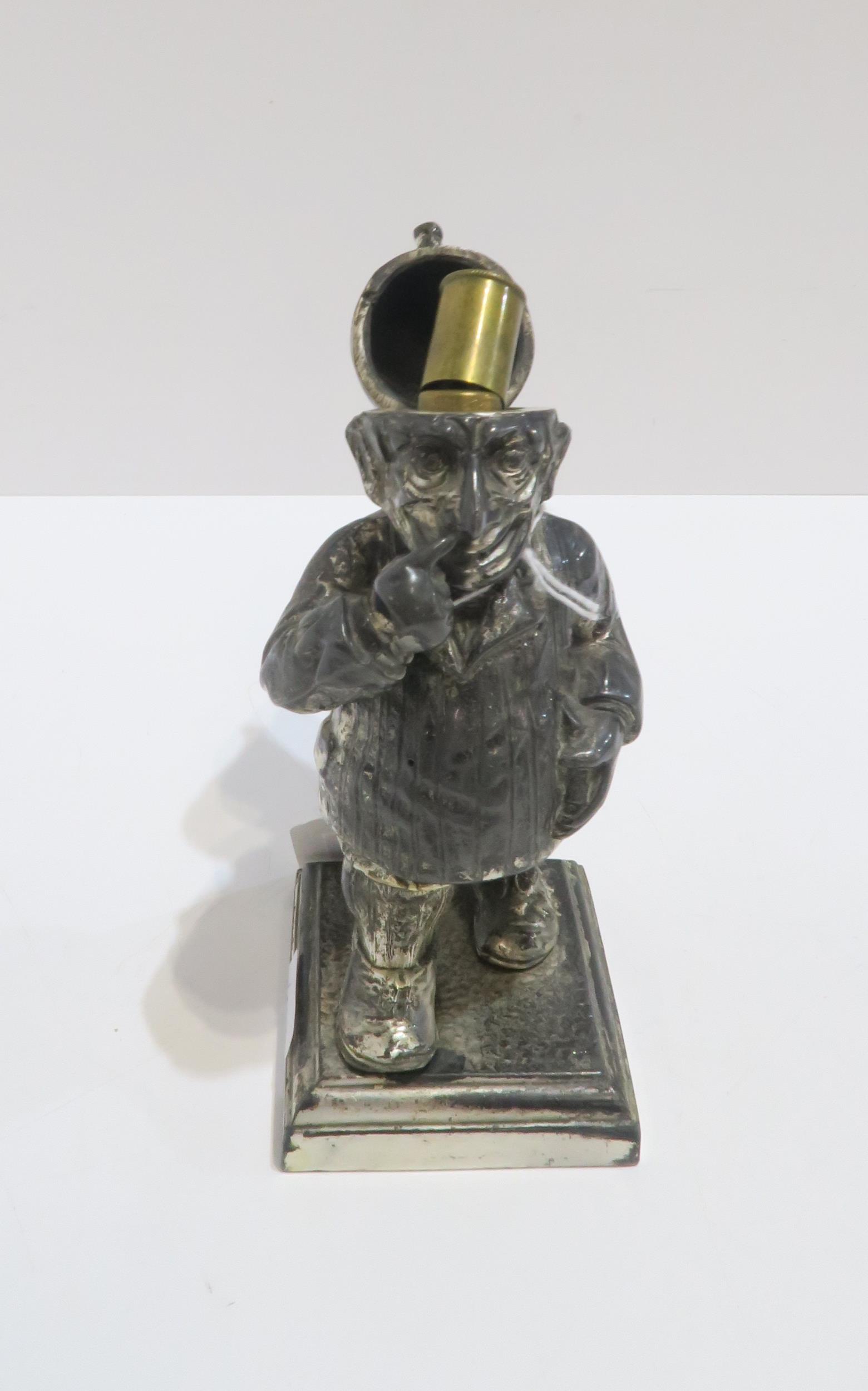 A Mr Punch table lighter, registered design number 782230 and a painted spelter figure of an - Bild 4 aus 4