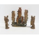 A collection of carved wood and soapstone figures Condition Report:Available upon request