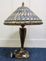 A 20th century Tiffany style table lamp with cast resin base Condition Report:Available upon