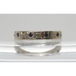 A white metal full eternity ring star set with sapphires and diamonds, indistinctly stamped '18'