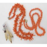 A string of coral barrel shaped beads, weight 18gms, a string of coral fringe beads, weight 23.