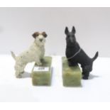 A pair of spelter terrier bookends mounted on onyx bases Condition Report:Available upon request