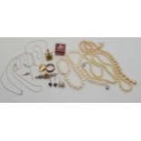 A silver amber set brooch, two pairs of earrings, chains, a rolled gold ring and other items