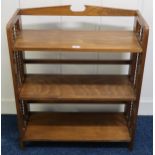 A 20th century teak three tier open folding bookcase, 87cm high x 71cm wide x 29cm deep Condition